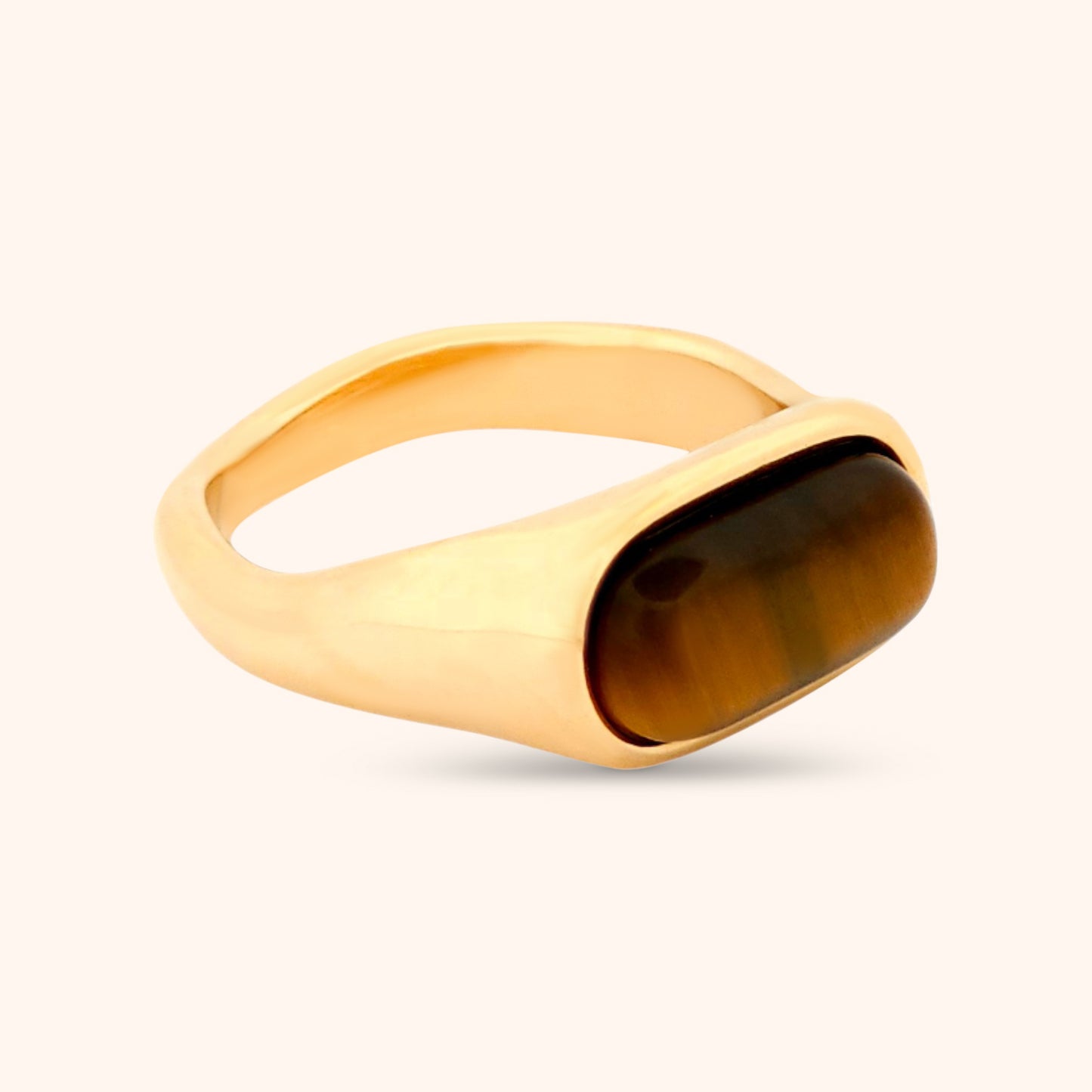 Angled view of the Marbella Ring, highlighting the smooth gold band and the unique chatoyancy of the Tiger's Eye gemstone.