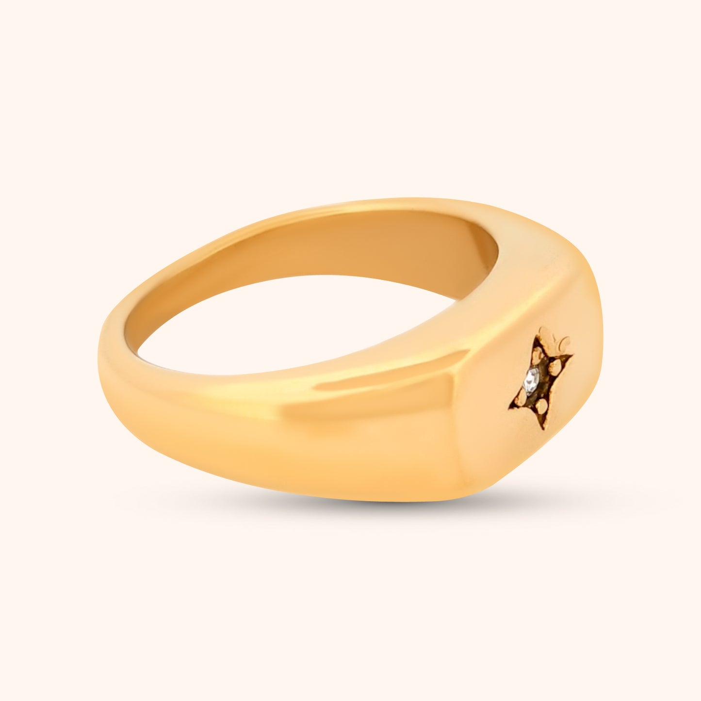 Angled view of the Buenos Aires Ring, highlighting the clean lines of the gold band and the sparkling CZ accent at the center of the celestial star.