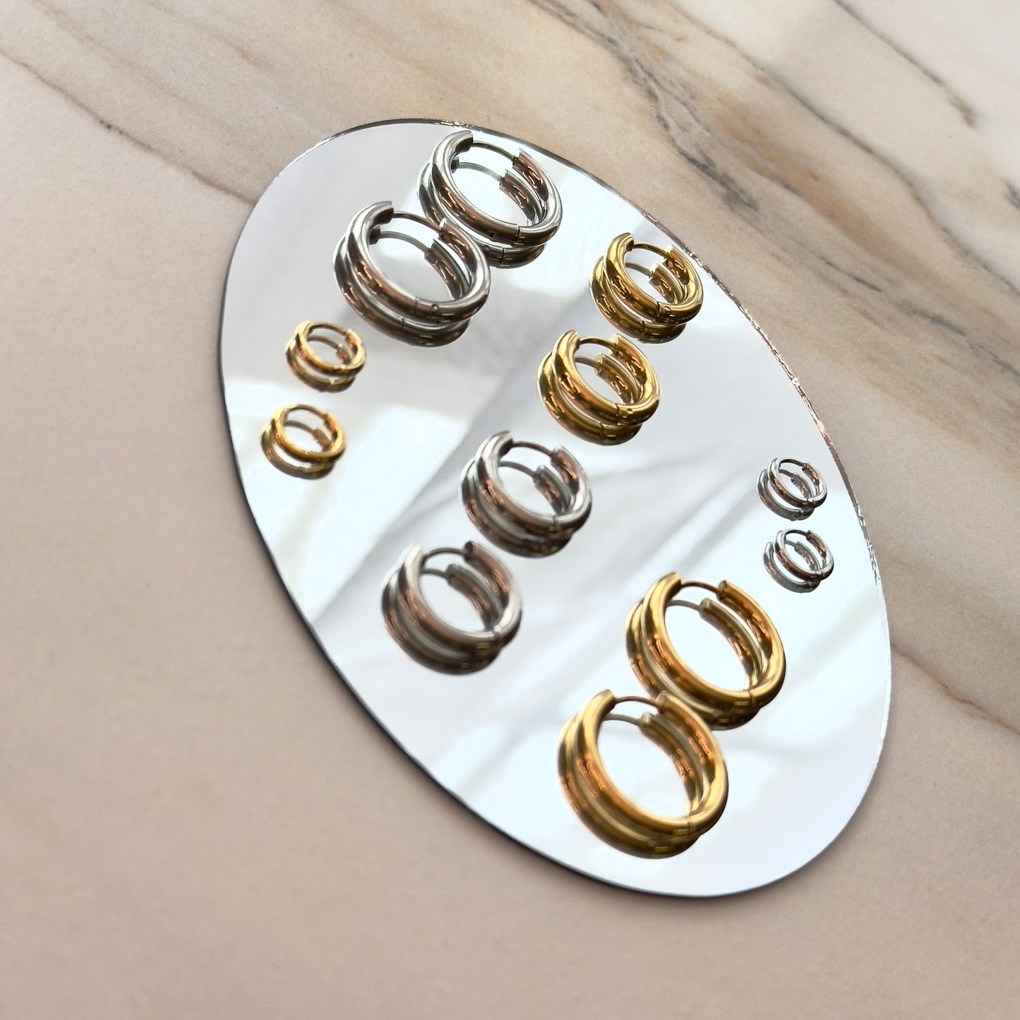 Pressie Perfect Huggie Earrings - Small, 14K gold plated stainless steel, showing multiple earrings for styling options.
