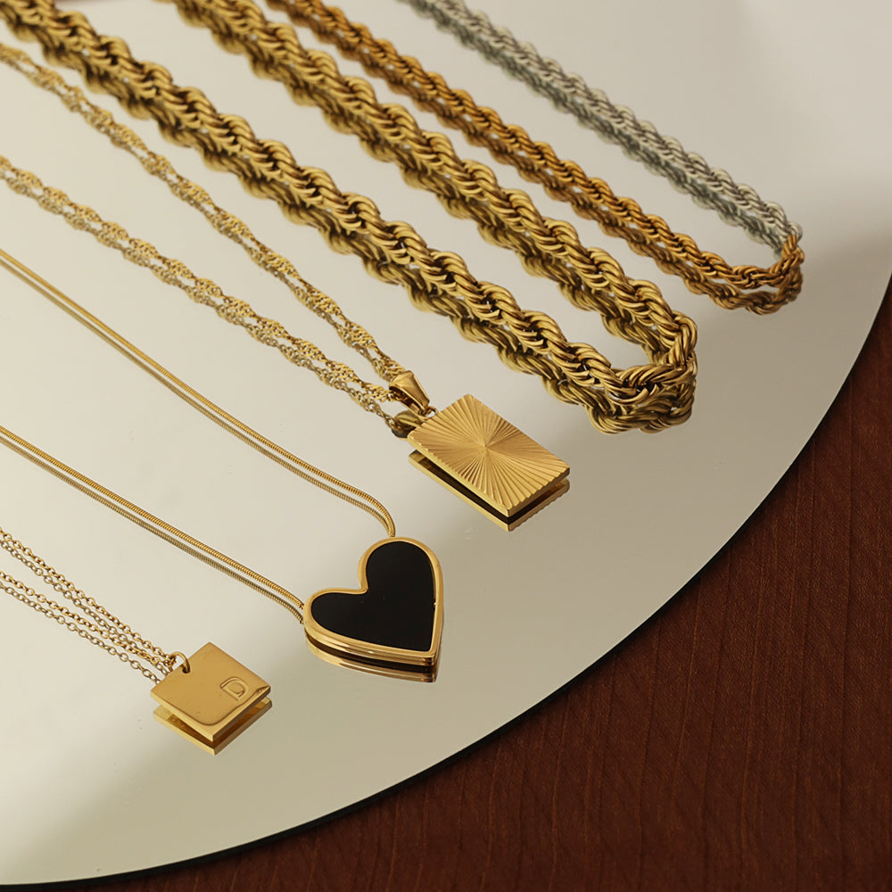 lack heart pendant necklace, 18K gold plated, showing with other necklaces
