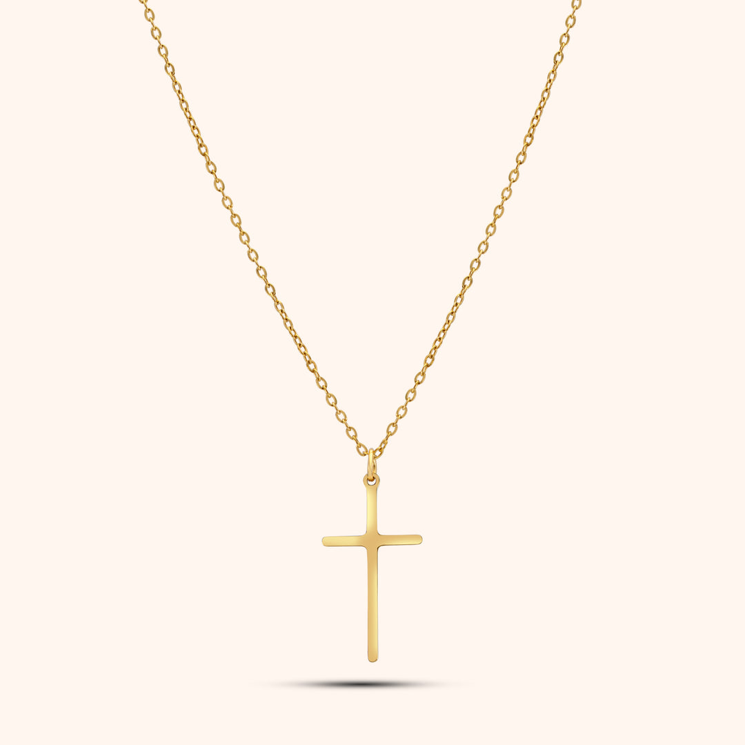 Pressie Dainty But Elegant Cross Charm Necklace, 18K gold plated stainless steel, showcasing the delicate cross charm and trace chain.