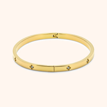 Gold clover bangle bracelet with clasp and crystal clover pattern