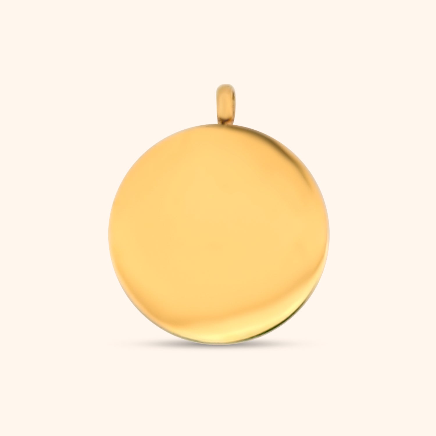 Rear view of the Stella Charm, a gold circular charm, highlighting the North Star detail and the charm's texture.