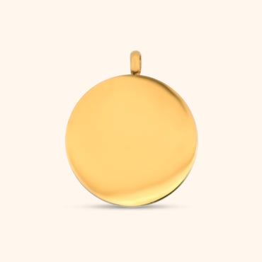 Rear view of the Stella Charm, a gold circular charm, highlighting the North Star detail and the charm's texture.