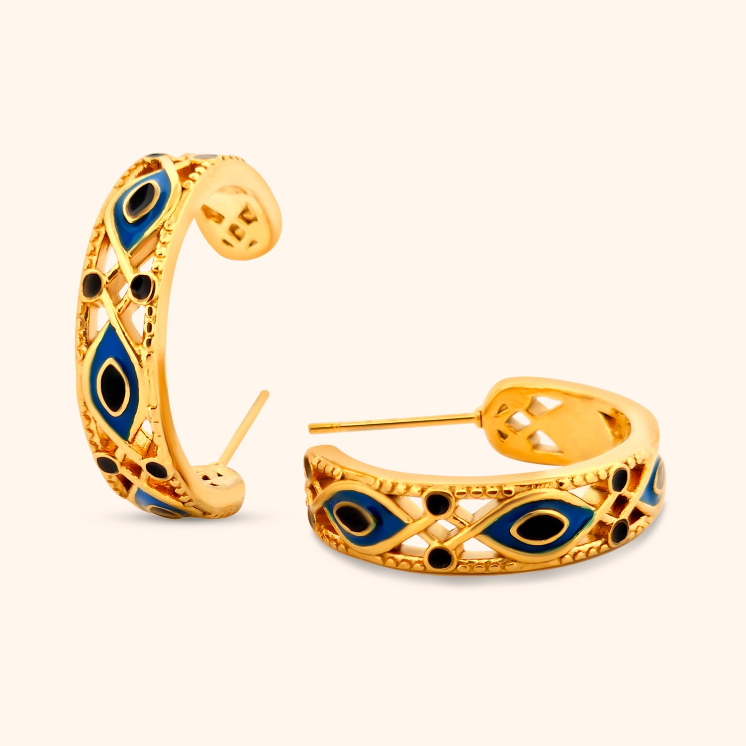 Pair of vintage-inspired gold hoop earrings with an elegant evil eye design, showcasing their classic yet unique style.