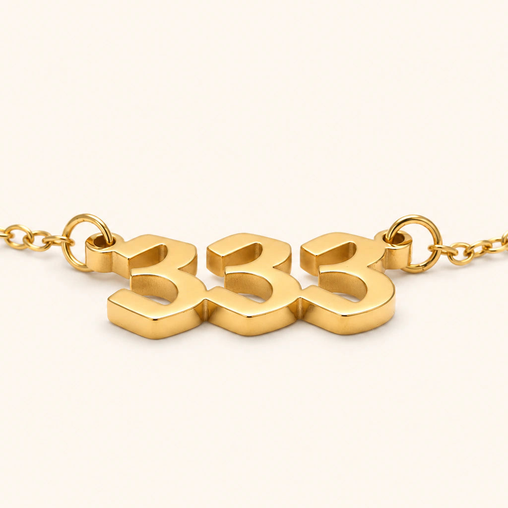 333 Angel Number Necklace at a 45 degree angle. 18k gold