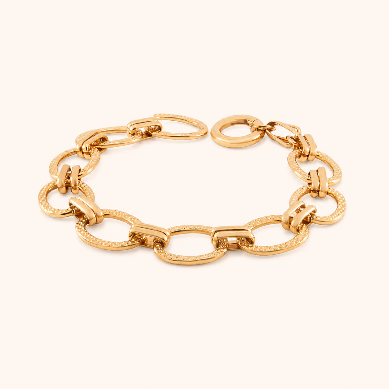 Gold chain bracelet on a white background