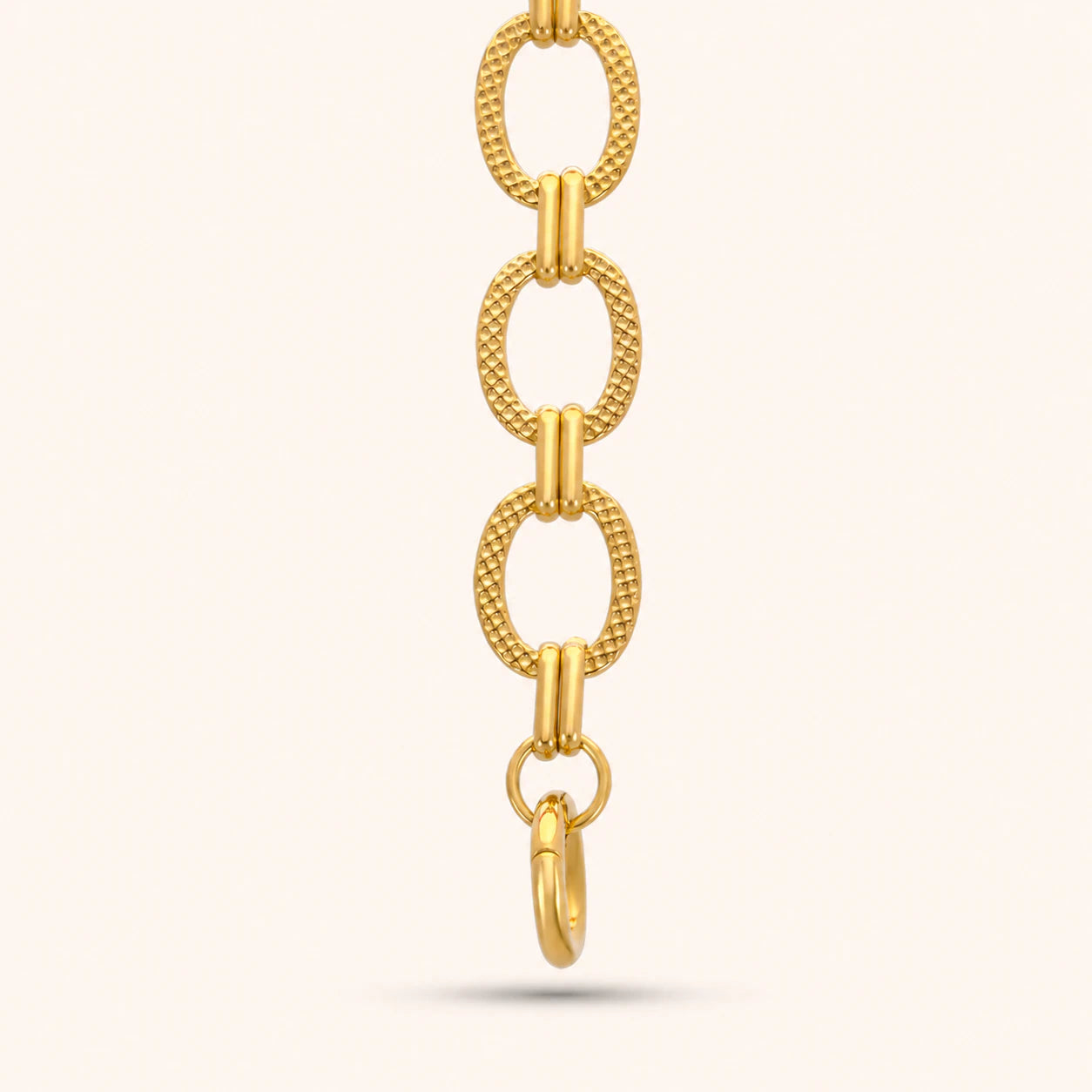 Gold chain extender on a white background