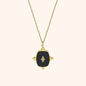 18k gold plated pendant necklace with black enamel and embossed emblem detail