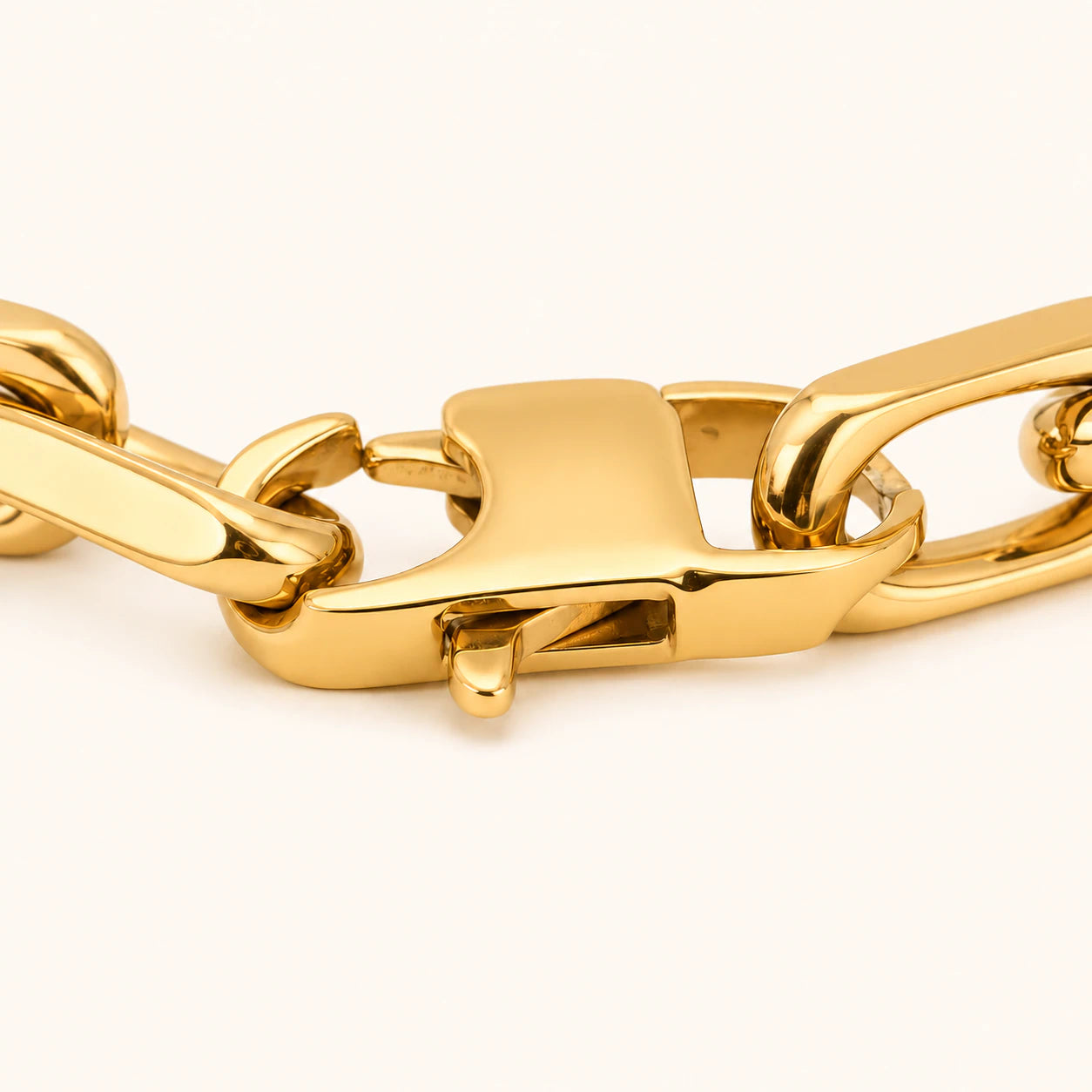 Gold chain bracelet on a white background