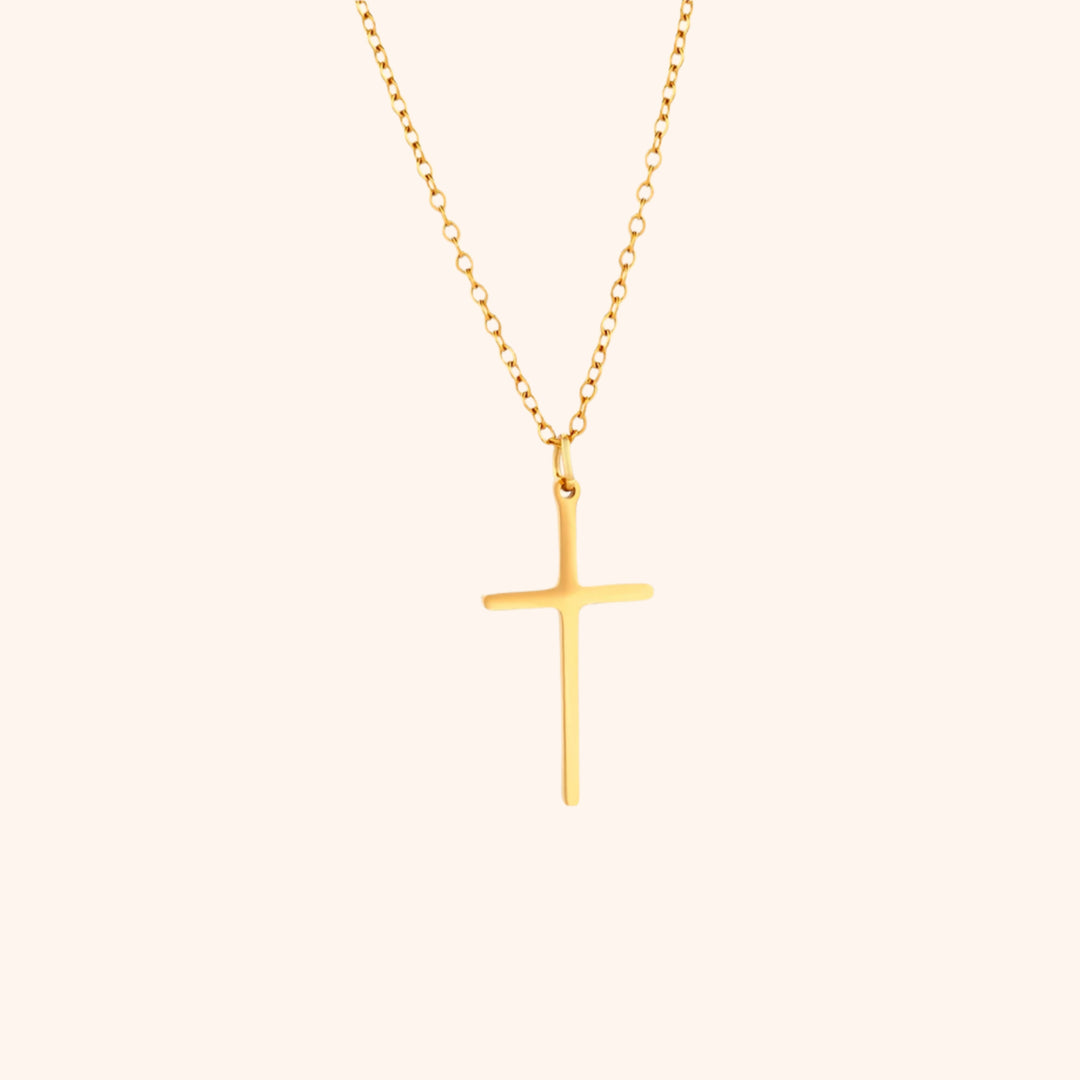 Pressie Dainty But Elegant Cross Charm Necklace, 18K gold plated stainless steel, showcasing the delicate cross charm and trace chain.