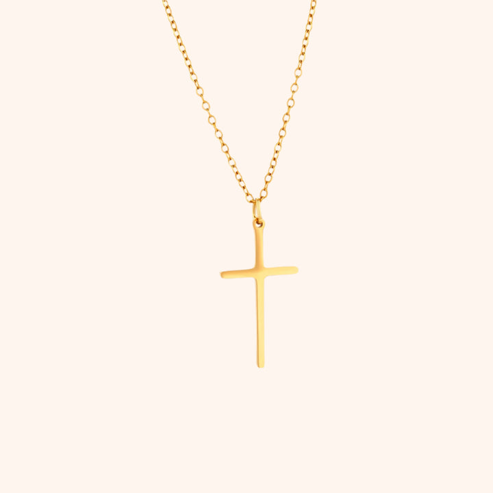 Pressie Dainty But Elegant Cross Charm Necklace, 18K gold plated stainless steel, showcasing the delicate cross charm and trace chain.