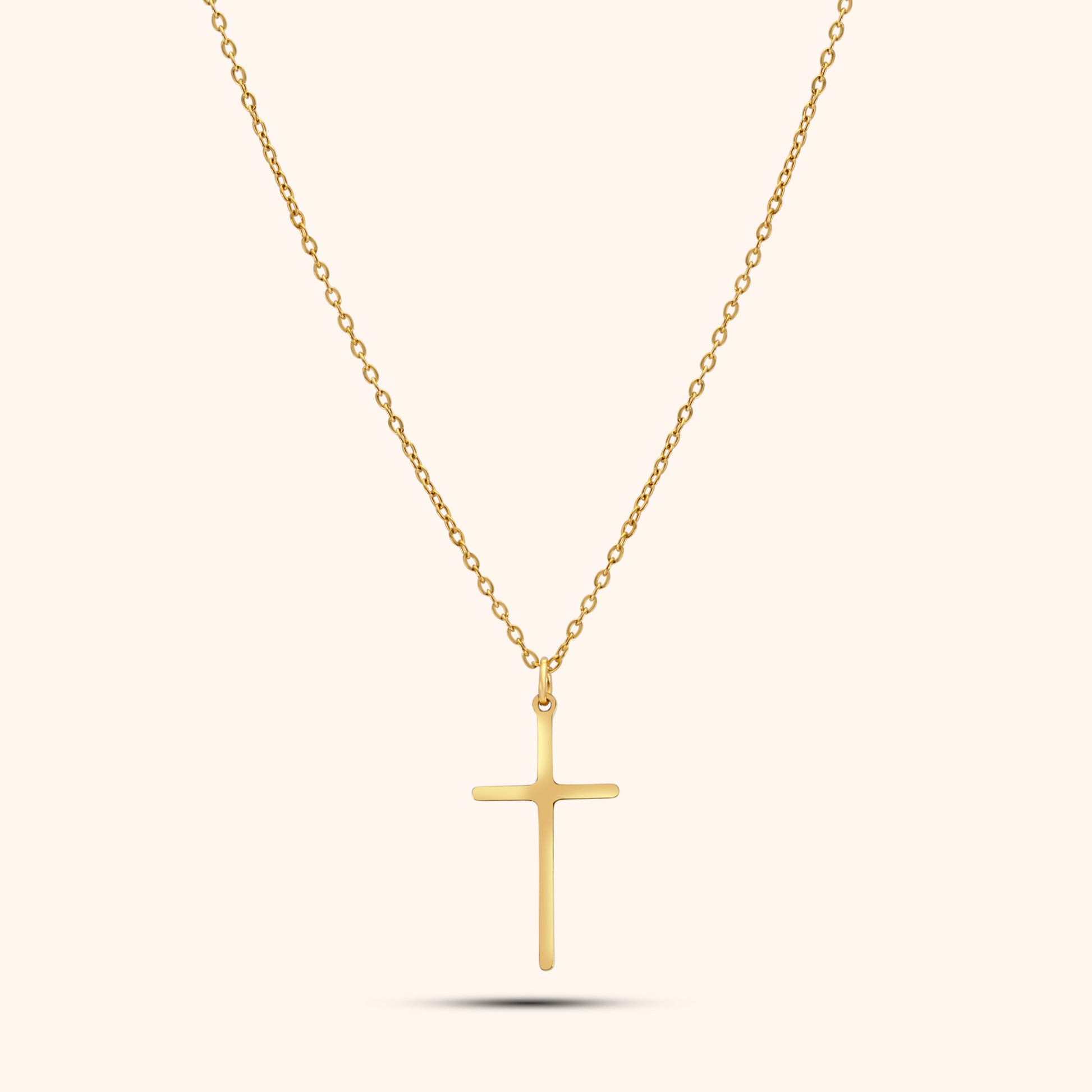 Pressie Dainty But Elegant Cross Charm Necklace, 18K gold plated stainless steel, showcasing the delicate cross charm and trace chain.