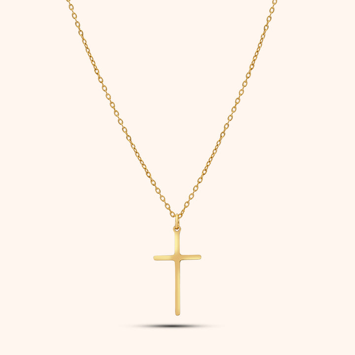 Pressie Dainty But Elegant Cross Charm Necklace, 18K gold plated stainless steel, showcasing the delicate cross charm and trace chain.