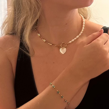 Pressie Golden Heart Harmony Necklace, 18K gold plated stainless steel, on model, showcasing elegant style.