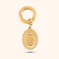 Close-up, angled view of a PRESSIE gold-plated, oval-shaped pendant hanging from a small, circular gold hoop earring clasp. The pendant features a textured border and a detailed, raised depiction of a landscape scene.