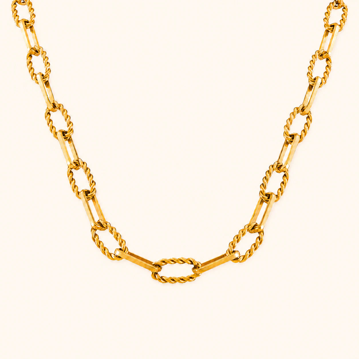 Gold chain necklace on a white background