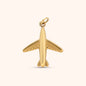 Gold airplane-shaped charm with smooth finish and rounded details, made of 18k gold plated stainless steel