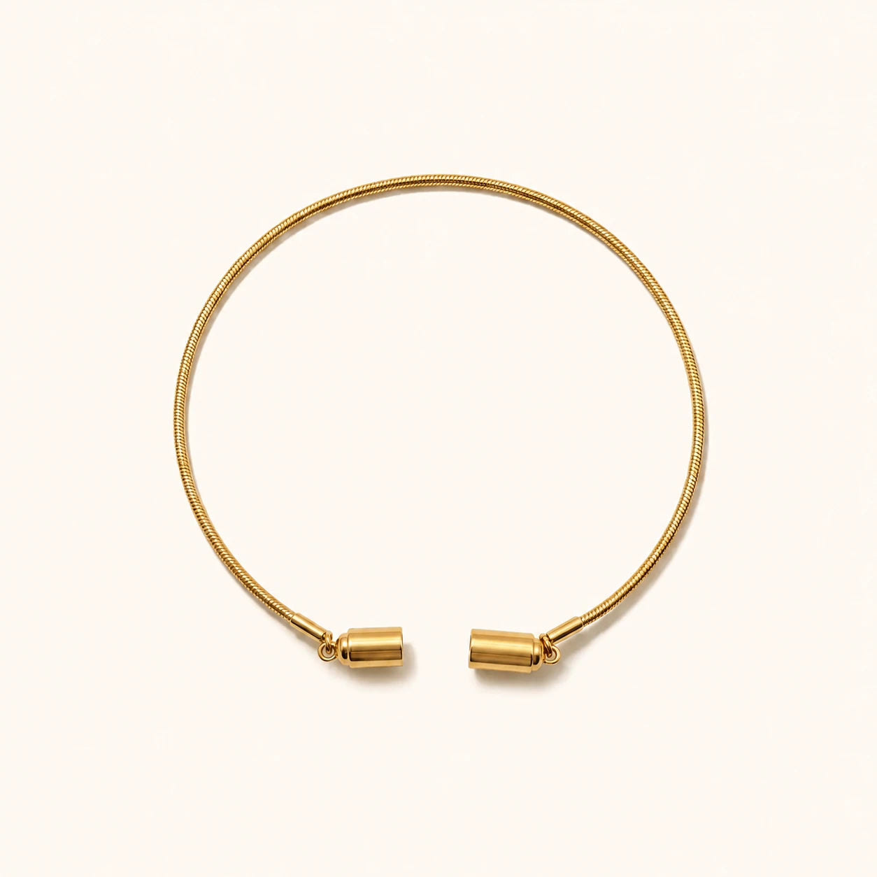 Gold bracelet on a white background