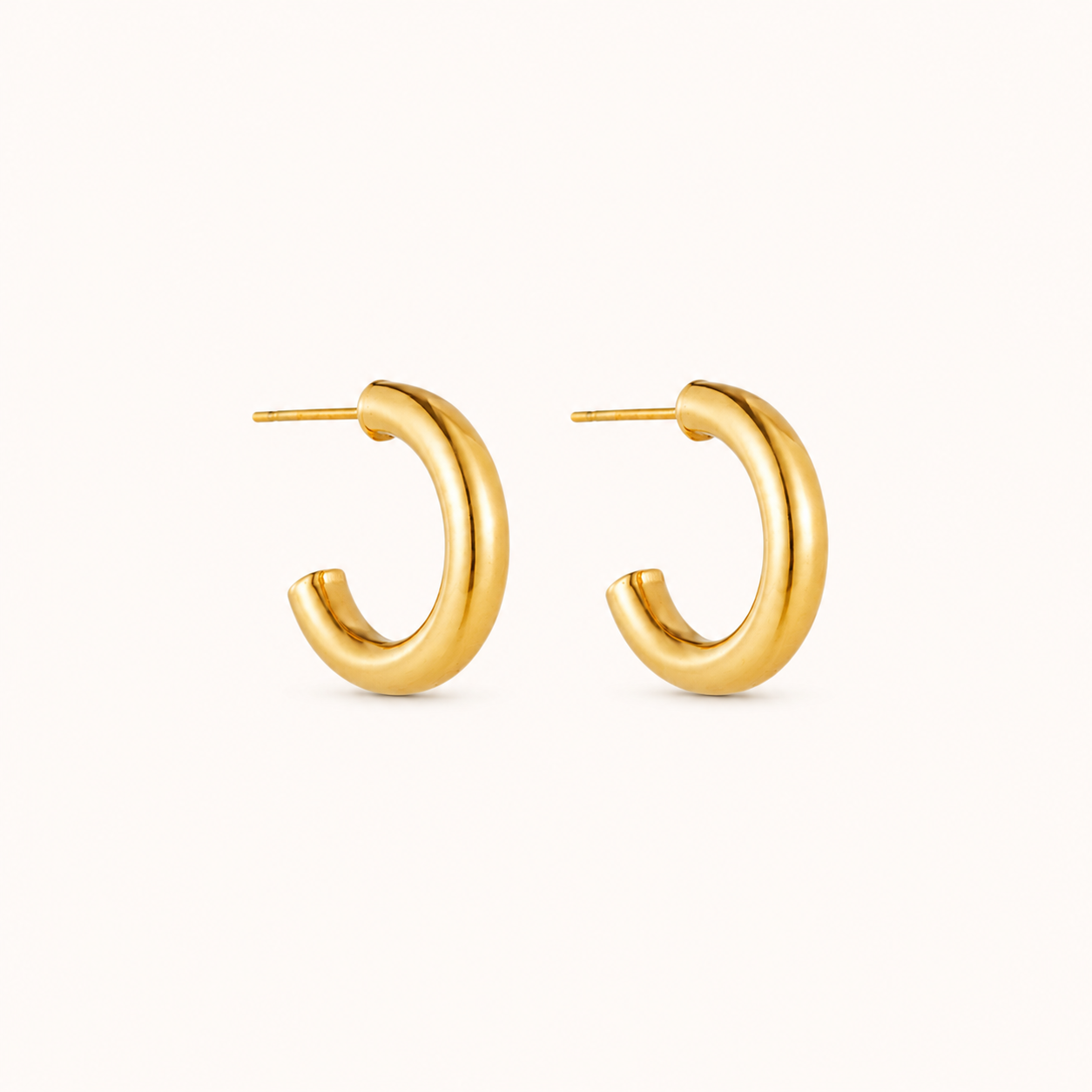 Gold hoop earrings on a white background