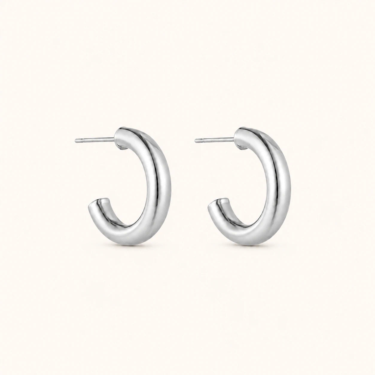 Silver hoop earrings on a white background