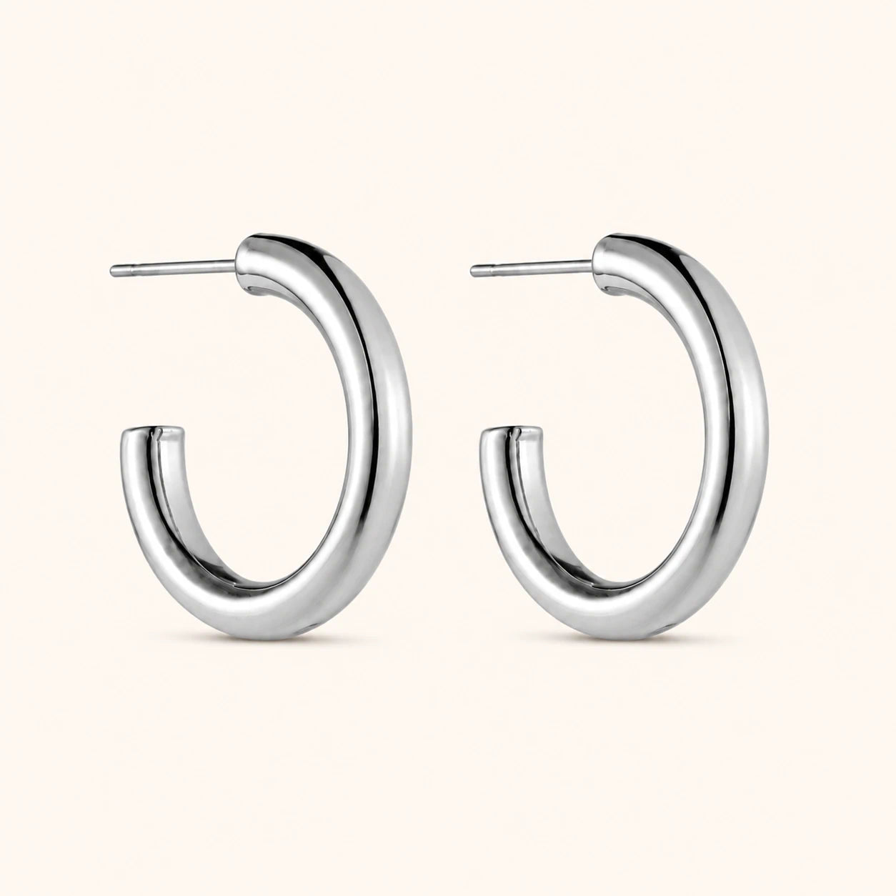 Silver hoop earrings on a white background