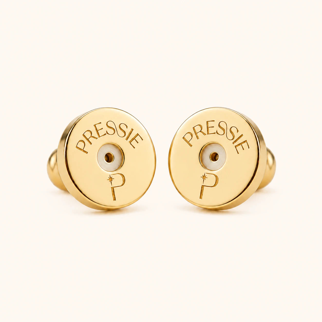 Gold earrings with 'PRESSIE' branding on a white background