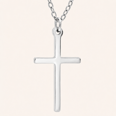 Silver cross pendant on a chain against a white background