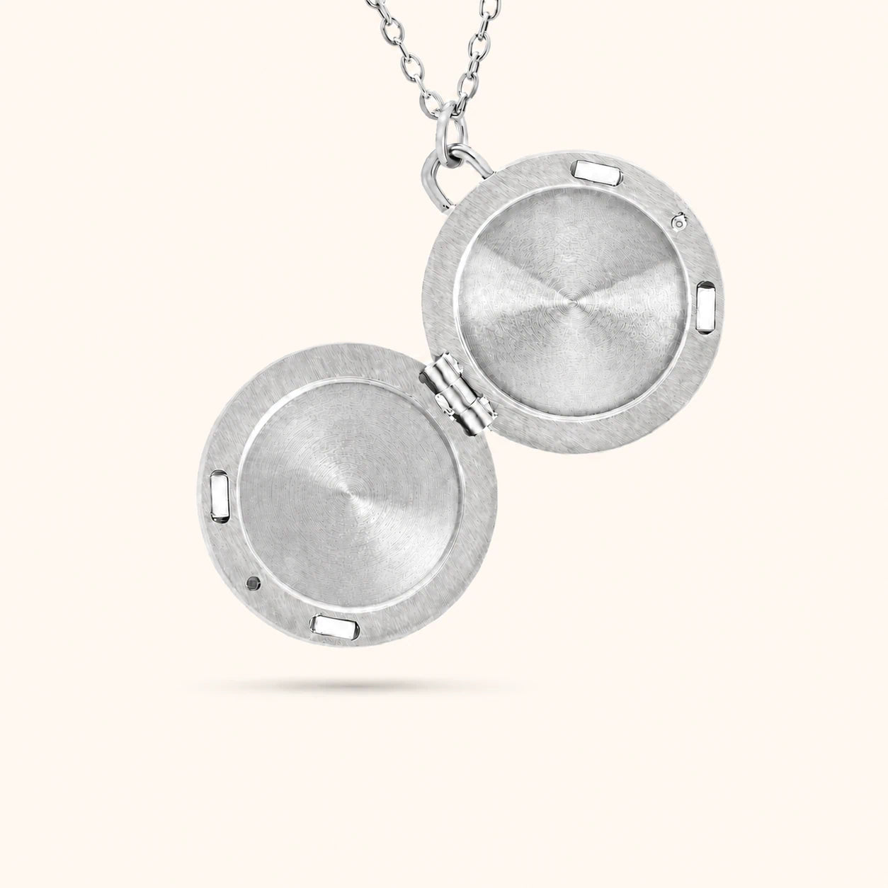 Silver locket necklace on a white background