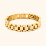 Gold bracelet on a white background